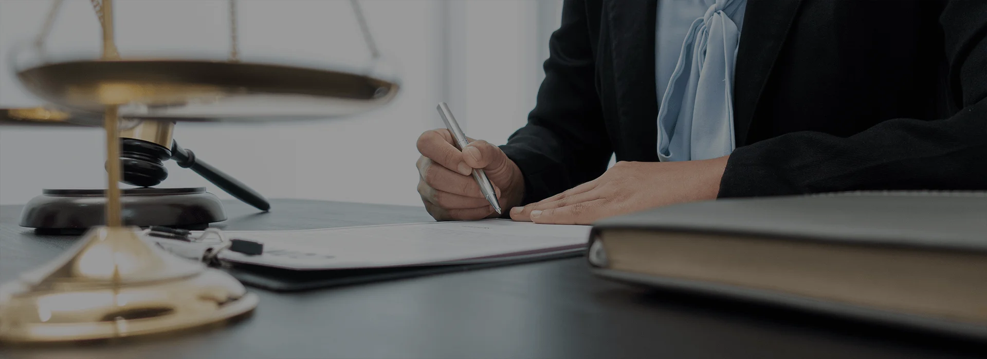 A key and a contract, symbolizing Real Estate Transactions. This complements the description of Defiant Law Group as a trusted navigator in real estate transactions, offering comprehensive representation and expert consulting services to lenders, escrow agents, brokers, private equity firms, and borrowers. It highlights their dedication to meticulously handling every transaction, identifying potential risks, and achieving clients' objectives. It represents their expertise in real estate law, including property valuation, title examinations, zoning compliance, and contractual disputes, with a commitment to personalized attention and tailored solutions to protect clients' interests.